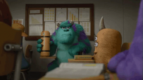 Sulley From Monsters Inc Is Holding A Hammer In His Hand GIF
