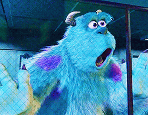Sulley From Monsters Inc Is Standing In Front Of A Fence With His Mouth Open GIF