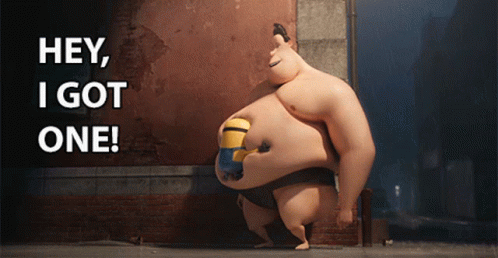 Sumo Wrestler With Minion On Belly Saying Hey I Got One GIF