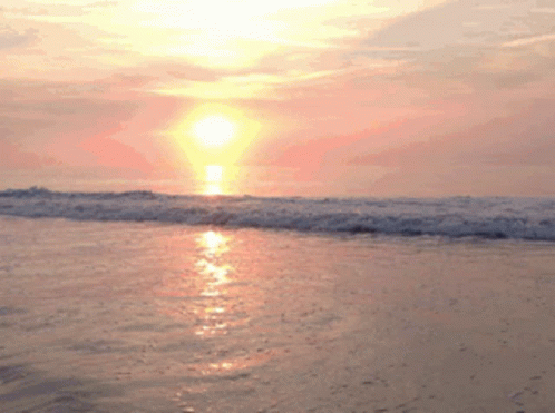 Sun Setting Over Breaking Waves