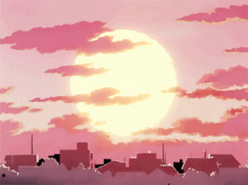 Sun Shining Over City In Pink Cloudy Sky GIF