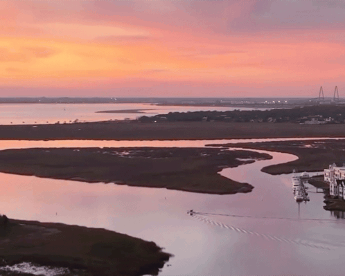 Sunset Over Water With Bridge GIF