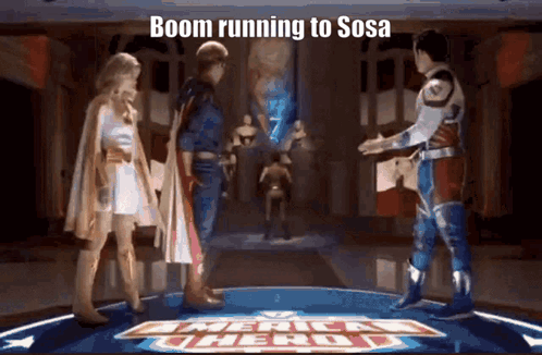 Superhero Group on Stage With Boom Running to Sosa Sign