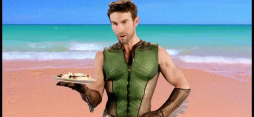 Superhero Man Holding Food on Beach