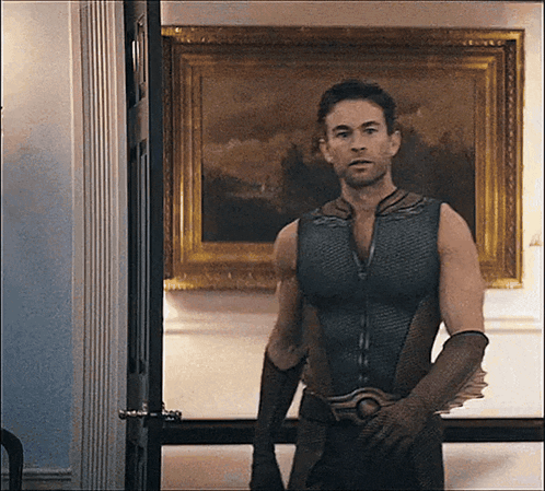 Superhero Man In Front Of Painting GIF