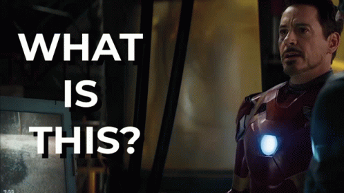 Superhero Man In Front Of Screen Saying What Is This GIF