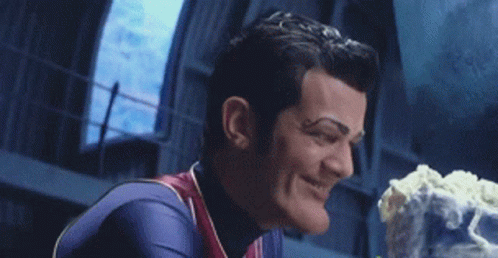 Superhero Smiling Holding Cake GIF