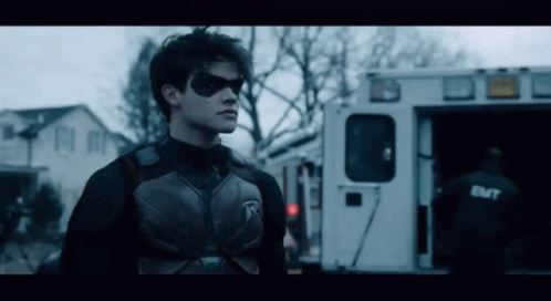 Superhero Standing In Front Of Ambulance GIF
