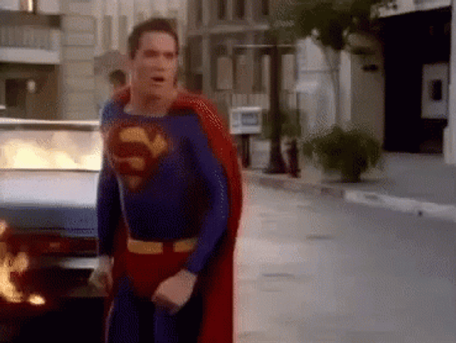 Superman Blow Air To Kill The Fire GIF