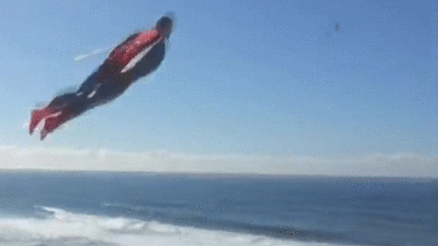 Superman Flying In Circles Above The Sea GIF