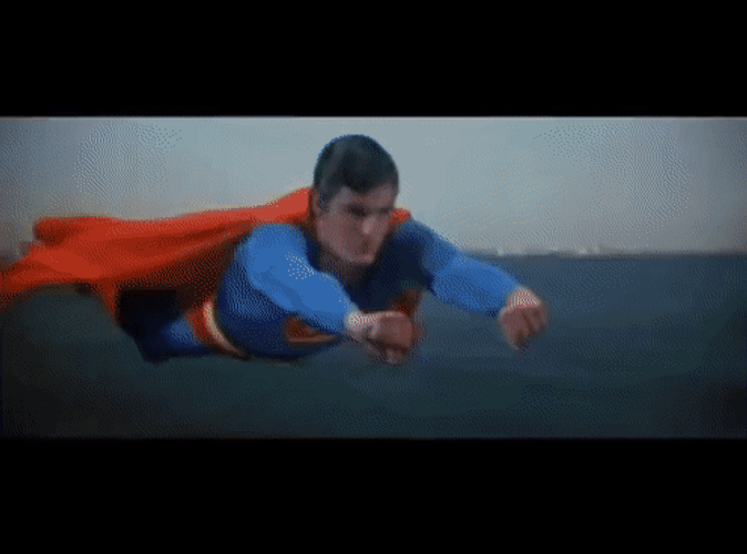 Superman Flying With Skyscrapers GIF