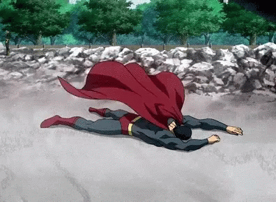 Superman Laying on Ground With Red Cape
