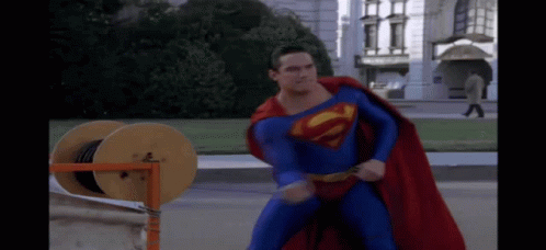 Superman Lying on Ground With Hands Up
