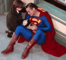 Superman Rubbing His Belly GIF