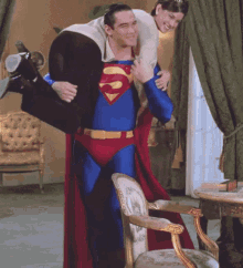 Superman Taking A Woman Over His Shoulder GIF