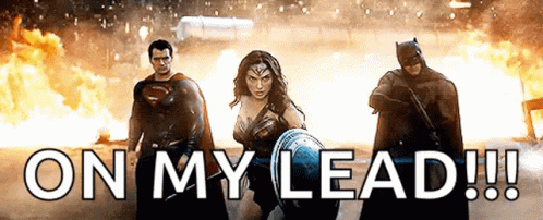 Superman , Wonder Woman And Batman Are Standing Next To Each Other In Front Of A Fire And The Words On My Lead ! GIF