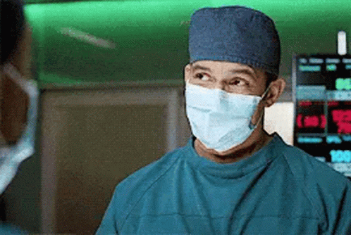 Surgeon Wearing Mask and Cap