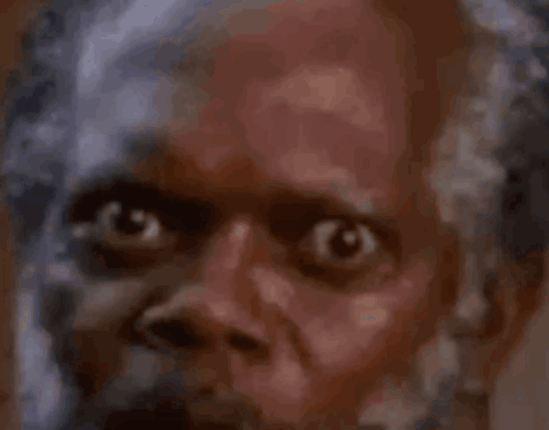 Surprised Bearded Man Looking at Camera