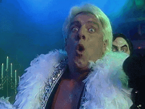 Surprised Man in Feather Boa