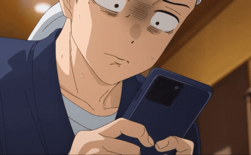 Surprised Man Looking at Cell Phone