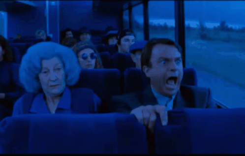 Surprised Man Sitting On Bus GIF