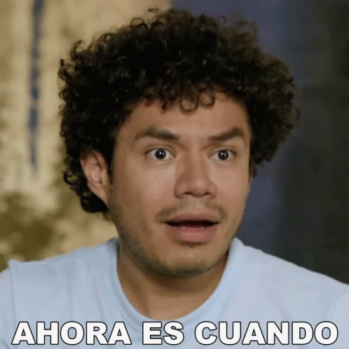 Surprised Man With Curly Hair Saying Ahora Es Cuando