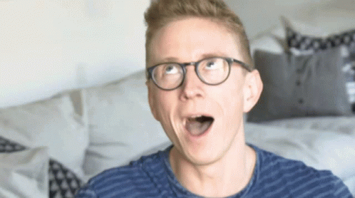 Surprised Man with Glasses and Blue Shirt