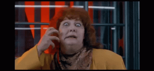 Surprised Red-Haired Woman in Yellow Jacket and Scarf