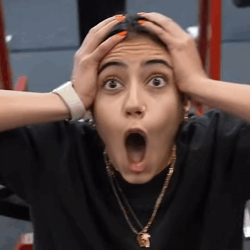 Surprised Woman Holding Head