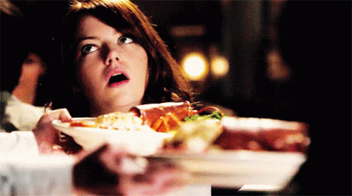 Surprised Woman Holding Plate of Food