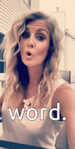 Surprised Woman in White Tank Top Saying Word