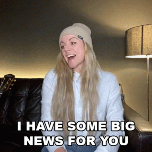 Surprised Woman On Couch Saying Big News GIF
