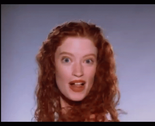 Surprised Woman With Red Hair GIF