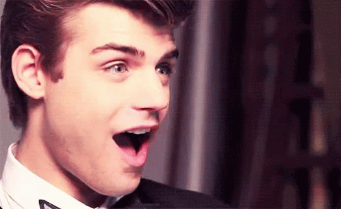 Surprised Young Man in Suit and Bow Tie