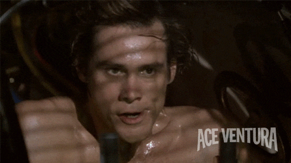 Sweaty Ace Ventura Wiping His Face GIF
