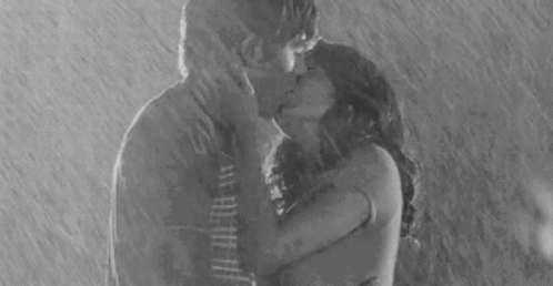 Sweet Couple Kissing In Monsoon Rain GIF