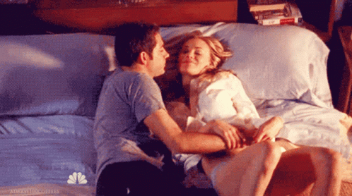 Sweet Couple On Bed Snuggles GIF