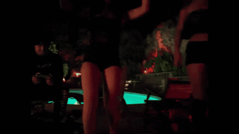 Swimming Pool at Night with Green Lights