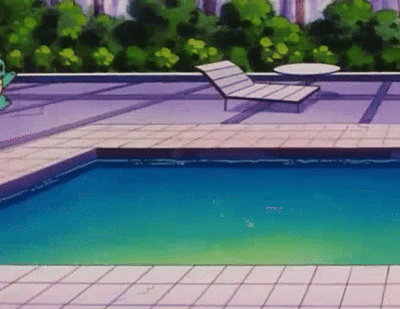 Swimming Pool Surrounded by Chairs and Table