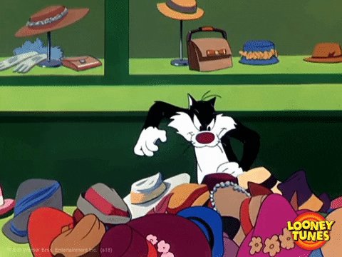 Sylvester Scrambling Through Black Friday Bargain Hats GIF