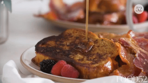Syrup Poured on French Toast with Berries and Bacon