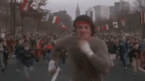 Syvester Stallone Sprint With Many People GIF