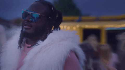T Pain With Fur Scarf Around His Shoulders GIF