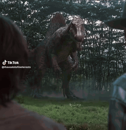 T-Rex Statue Standing In Grass GIF