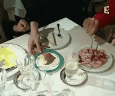 Table With Plates of Food and Letter E