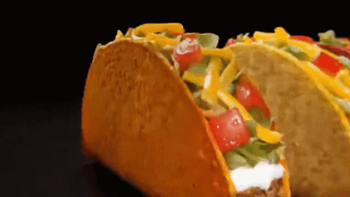 Taco With Tomatoes Cheese Lettuce Sour Cream
