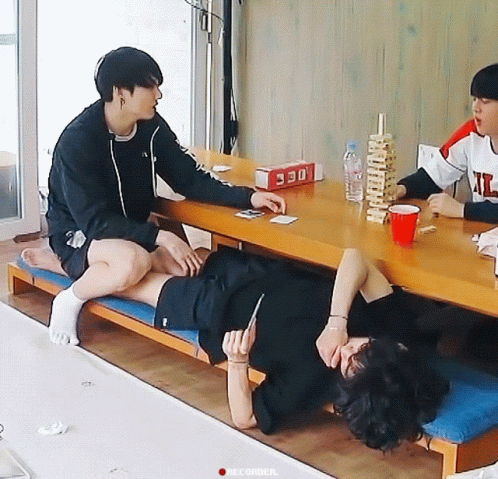 Taekook Relaxing On A Chair GIF