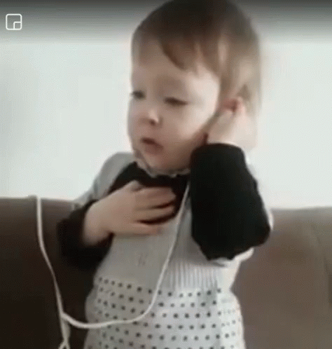 Baby Keeps Talking On Phone GIF