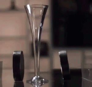 Tall Glass Beside Black Tape