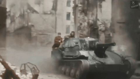 Tank Driving Through City Street